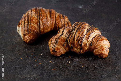 Croissant filled with chocolate Cream isolated two pieces. High quality photo
