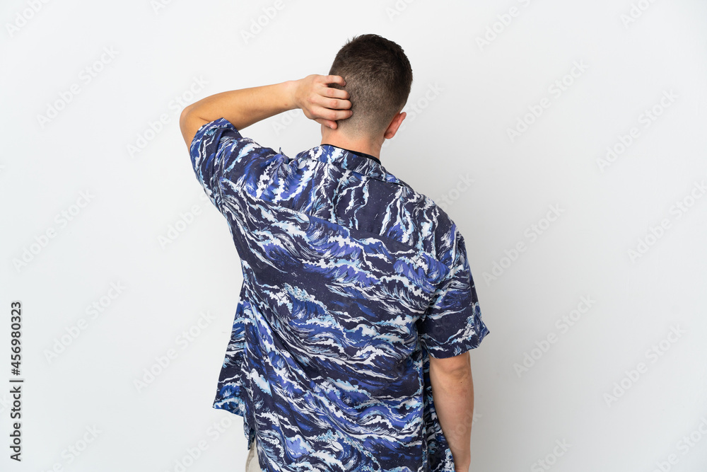 Young caucasian man isolated on white background in back position and thinking Young caucasian man isolated on white background in back position and thinking