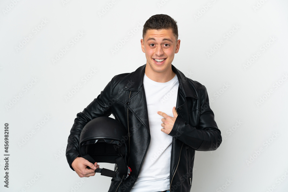 Caucasian man with a motorcycle helmet isolated on white background with surprise facial expression Caucasian man with a motorcycle helmet isolated on white background with surprise facial expression