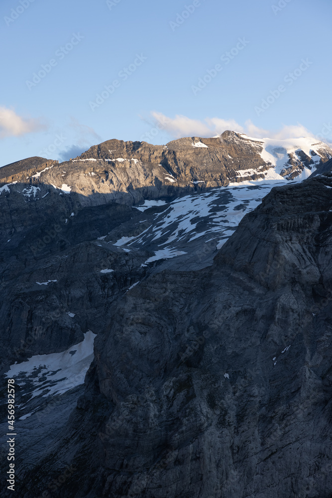 Amazing view to the peaks of the alps in Switzerland. Beautiful scenery in one of the most beautiful place in the world. Snow covered peaks and a blue sky.