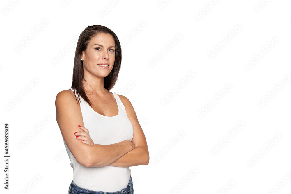 Portrait of a happy woman standing with arms folded isolated on a white background. Looking at camera Portrait of a happy woman standing with arms folded isolated on a white background. Looking at camera