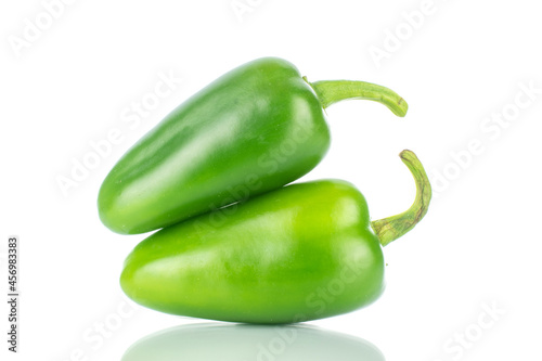 Two green spicy pepper pods, close-up, isolated on white.