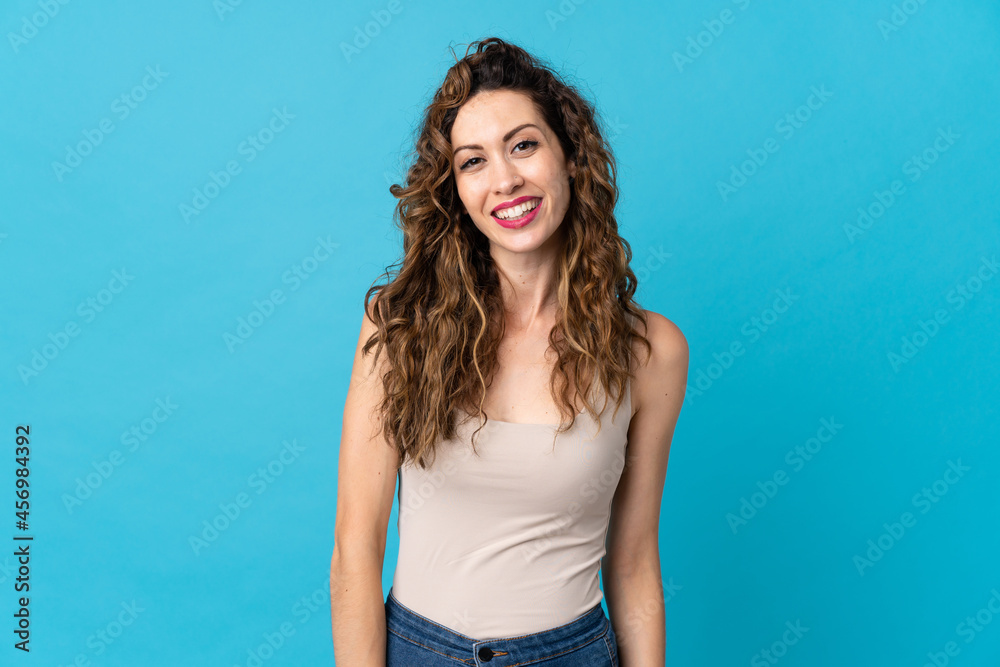 Young caucasian woman isolated on blue background laughing Young caucasian woman isolated on blue background laughing
