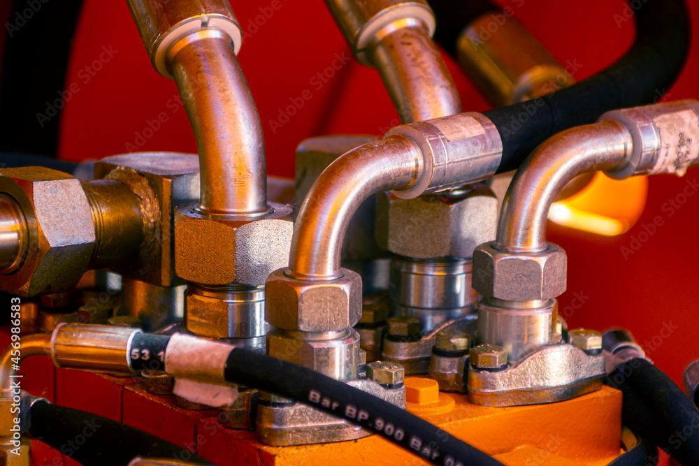 Close up of pipe system of hydraulic valves Close up of pipe system of hydraulic valves