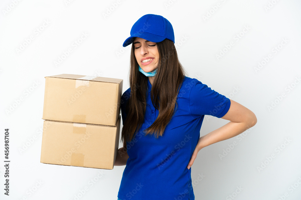 Delivery caucasian woman isolated on white background suffering from backache for having made an effort Delivery caucasian woman isolated on white background suffering from backache for having made an effort