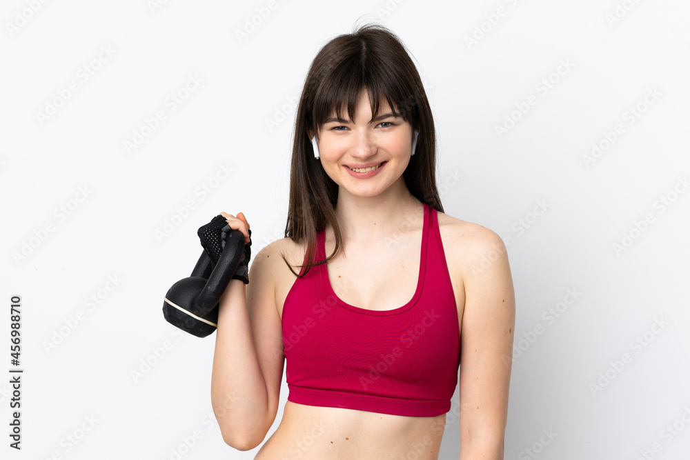 Young sport woman isolated on white background making weightlifting with kettlebell Young sport woman isolated on white background making weightlifting with kettlebell