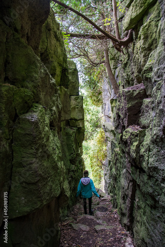 hiking in the mountains through a crevasse