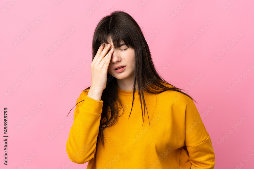 Young Ukrainian woman isolated on pink background with headache Young Ukrainian woman isolated on pink background with headache
