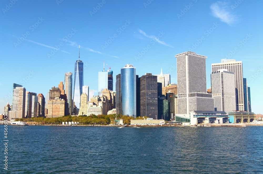 landscape view of lower manhattan on sunny day with beautiful clear blue sky background