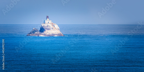 The Tillamook Lighthouse in the Pacific Ocean near to the Ecola State Park, Oregon photo
