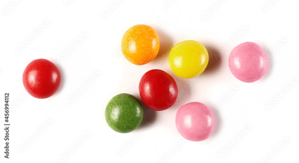 Colorful candies isolated on white background, top view