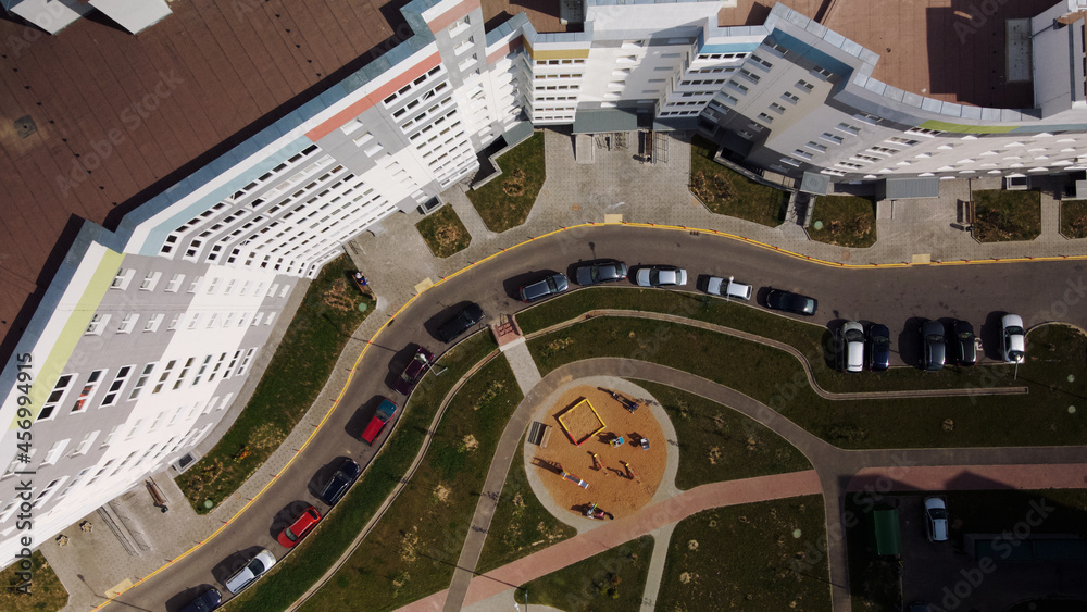 Fototapeta premium City block. Modern multi-storey buildings. The courtyard area and playgrounds are visible. Aerial photography.