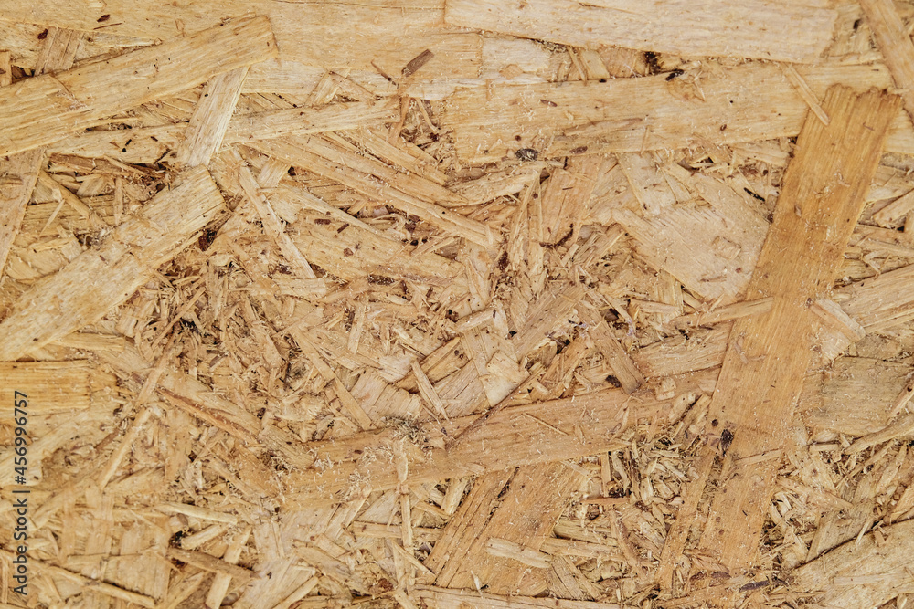 OSB texture can be used as background. Construction, fresh renovation, building materials concept OSB texture can be used as background. Construction, fresh renovation, building materials concept