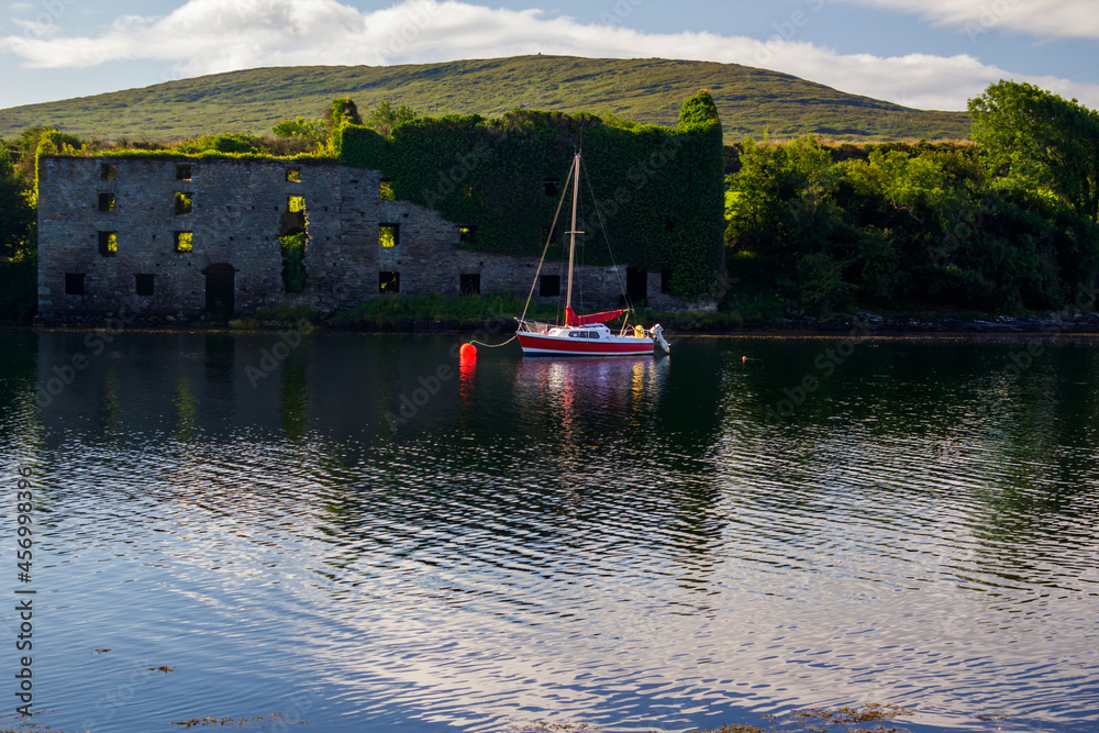 Boat moored in front of the ruined building Boat moored in front of the ruined building