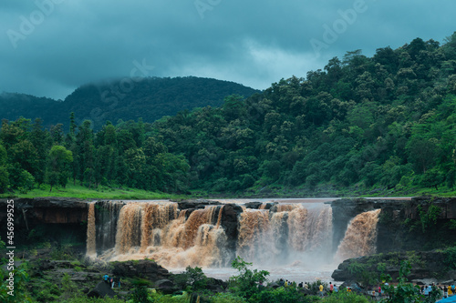 Beautiful view of Gira waterfall with green mountain in background during monsoon season at Waghai  Saputara  Gujarat  India