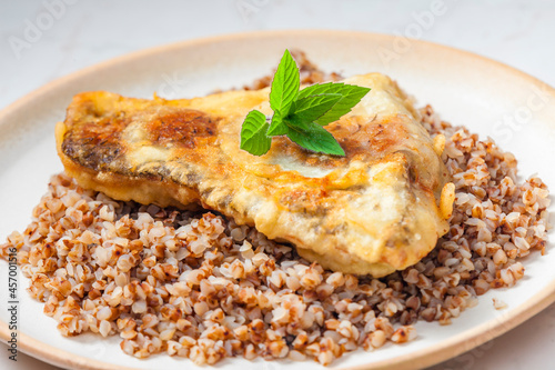 fried carp with bulgur and mint