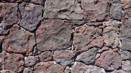 Old gray stone wall as a texture