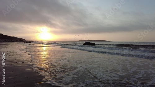Golden Sunrise over Tidal Flats with Gulls 