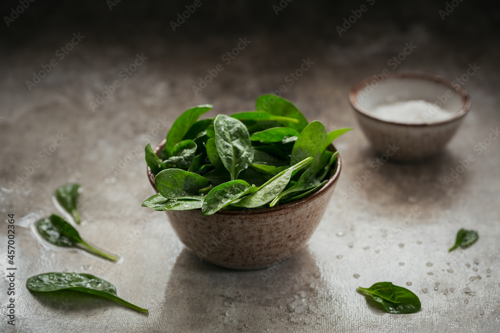 Leaves of fresh baby spinach in a Bowl. Leaves of fresh baby spinach in a Bowl.