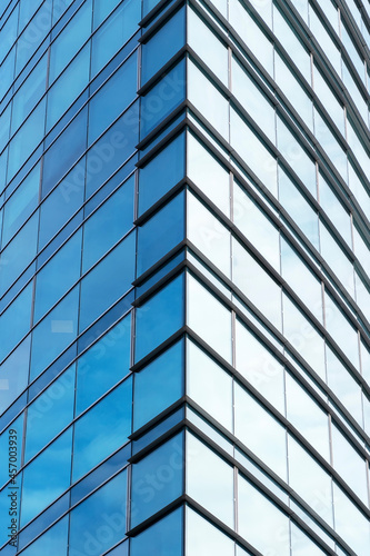 corner of symmetric geometry at glass window of modern office commercial building