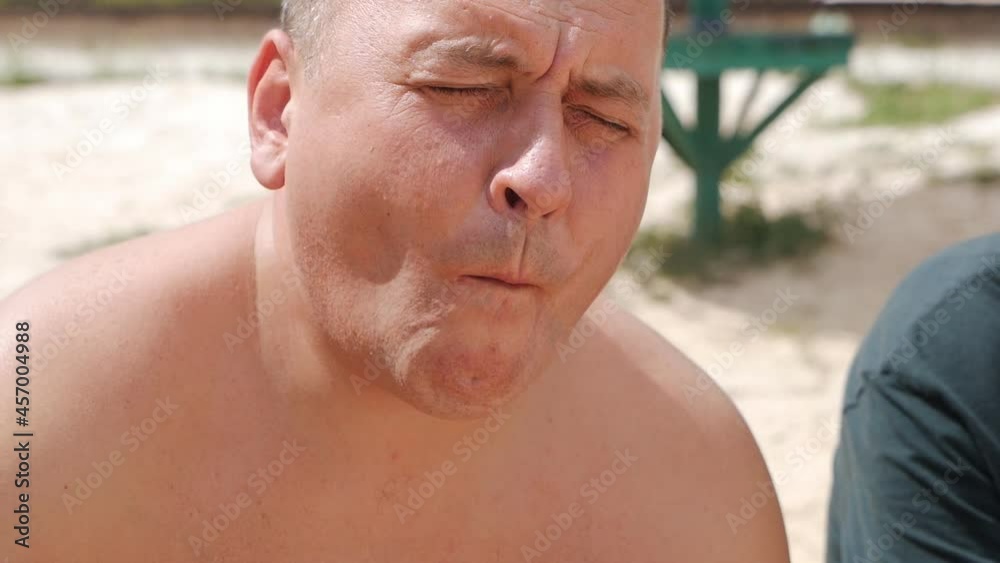 The man is eating a juicy watermelon. Hot summer, delicious fruits.low motion The man is eating a juicy watermelon. Hot summer, delicious fruits.low motion