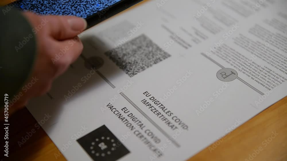 Person scanning the QR code of a covid 19 certificate. Scanning the ...