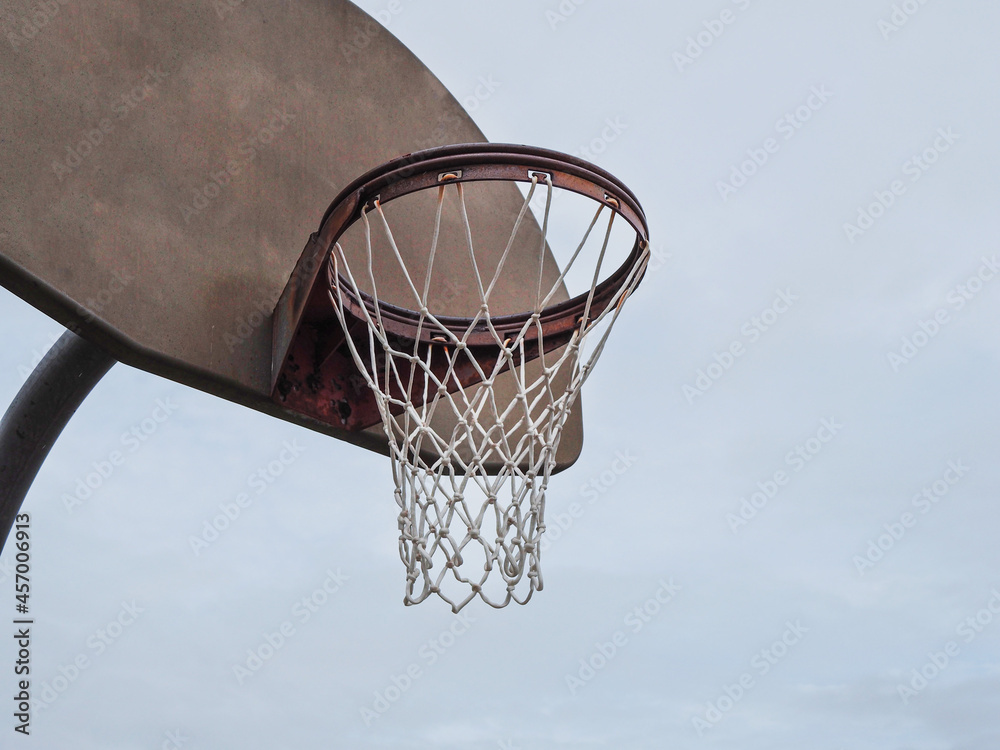 Basketball rim on a cloudy day