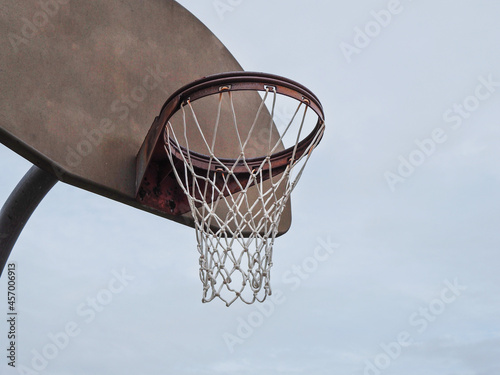 Basketball rim on a cloudy day