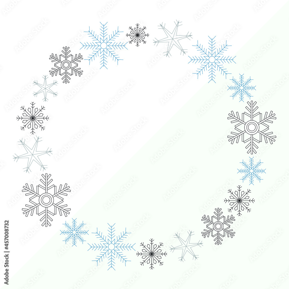 Winter theme frame made of blue, grey and black snowflakes on grey and white background. Winter, seasonal. Copy space.