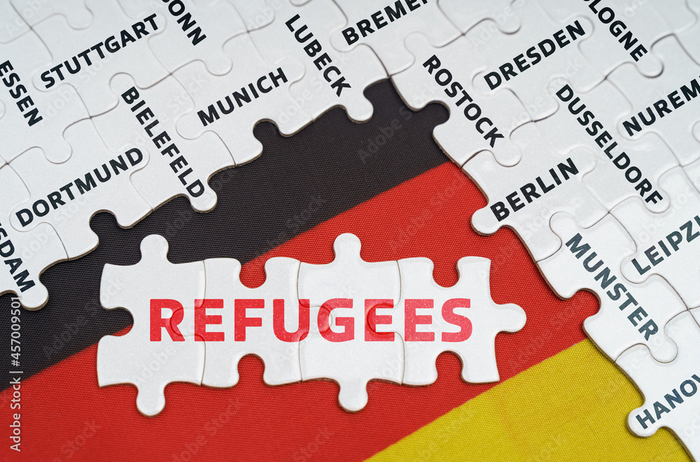 On the flag of Germany there are puzzles with the names of cities and puzzles with the inscription - refugees