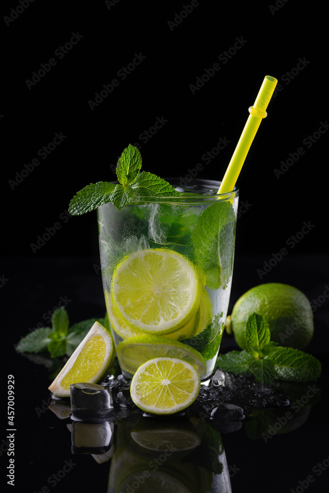 Refreshing summer alcoholic cocktail mojito with ice, fresh mint and lime Refreshing summer alcoholic cocktail mojito with ice, fresh mint and lime