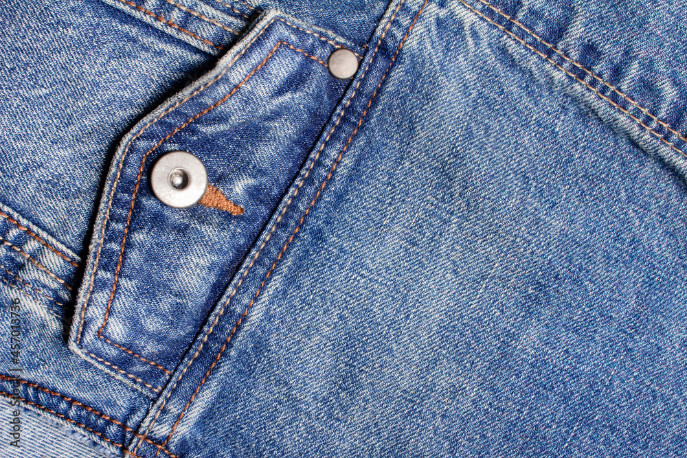 Texture backdrop photo of blue colored denim cloth with pocket and seams. Texture backdrop photo of blue colored denim cloth with pocket and seams.