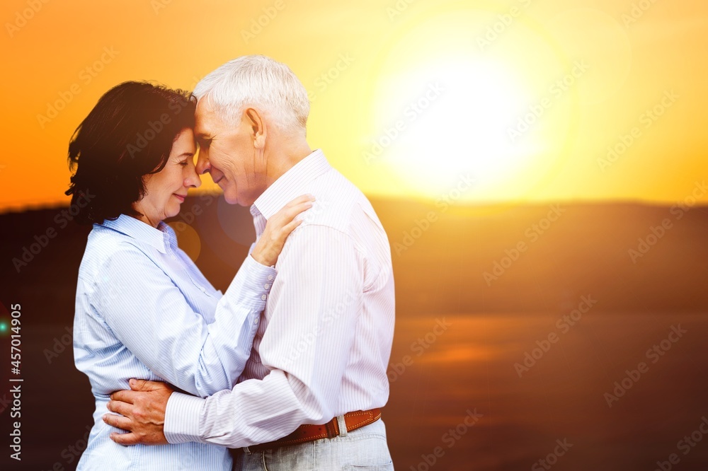 Couple lovers hugging and kissing at sunset. Love, youth, happiness concept. Couple lovers hugging and kissing at sunset. Love, youth, happiness concept.