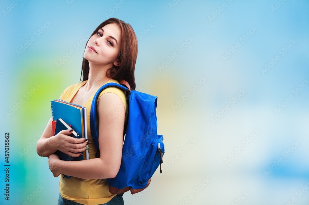 Excited young woman student hold notebooks Excited young woman student hold notebooks