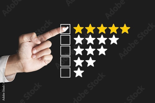 Hand touching and doing mark to five stars, the best customer satisfaction