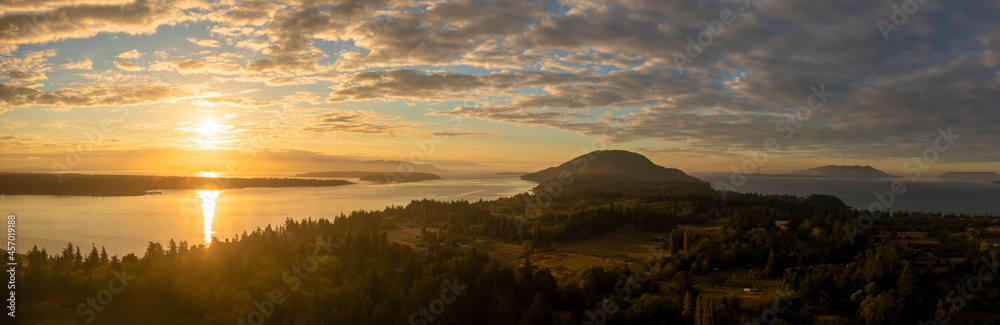 Summer Sunrise Over Lummi Island and the Salish Sea. Aerial drone view over this lovely island located minutes by ferry from Bellingham, Washington.