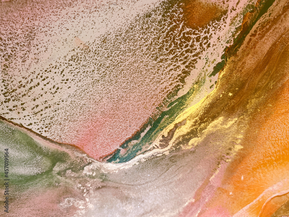 Abstract colorful art with pink, orange, green and gold — natural background, beautiful smudges, stains and veins, made with alcohol ink. Fluid texture resembles lichen, leaf, watercolor, aquarelle.