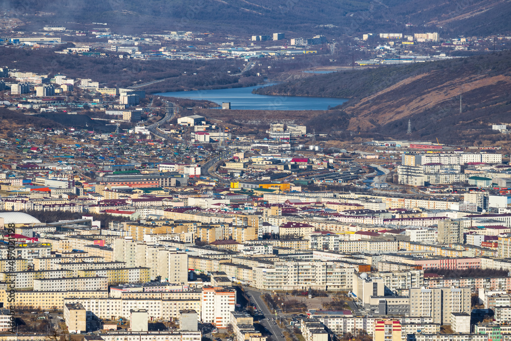 Aerial view of the city of Magadan. Top view of the streets and buildings. Magadan, Magadan region, Siberia, Far East of Russia.