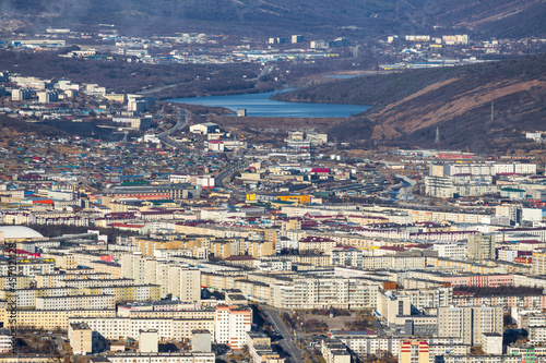 Aerial view of the city of Magadan. Top view of the streets and buildings. Magadan, Magadan region, Siberia, Far East of Russia.