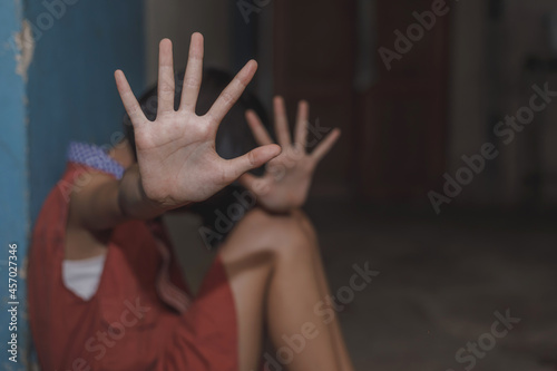 Kid girl showing hand signaling to stop useful to campaign against violence and pain. Stop abusing. terrified kid , A fearful child.