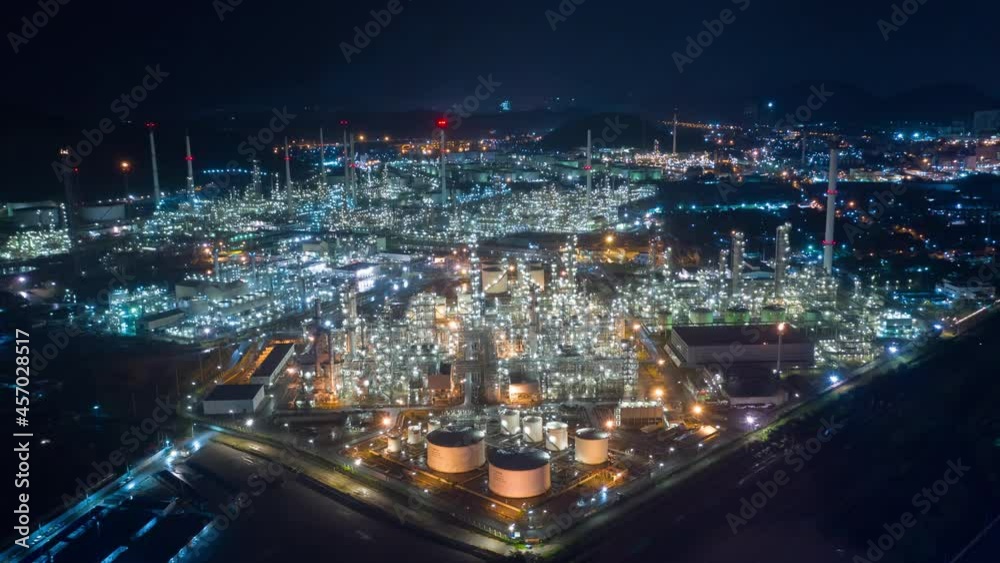Aerial view Oil refinery. Industrial view at oil refinery plant form industry zone with sunrise and cloudy sky. Aerial view Oil refinery. Industrial view at oil refinery plant form industry zone with sunrise and cloudy sky.