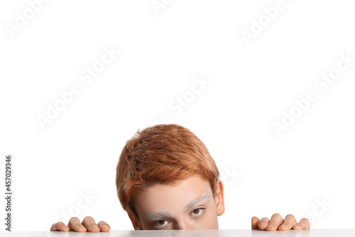 Teenage boy with dyed eyebr...