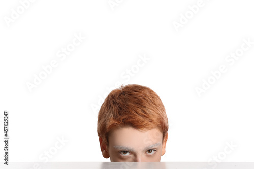 Teenage boy with dyed eyebr...