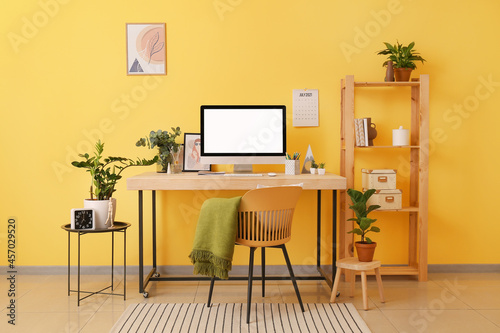 Interior of stylish room with comfortable workplace