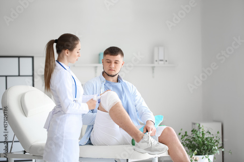 Doctor applying bandage ont...