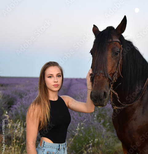 a young blonde model in a gorgeous lavender field