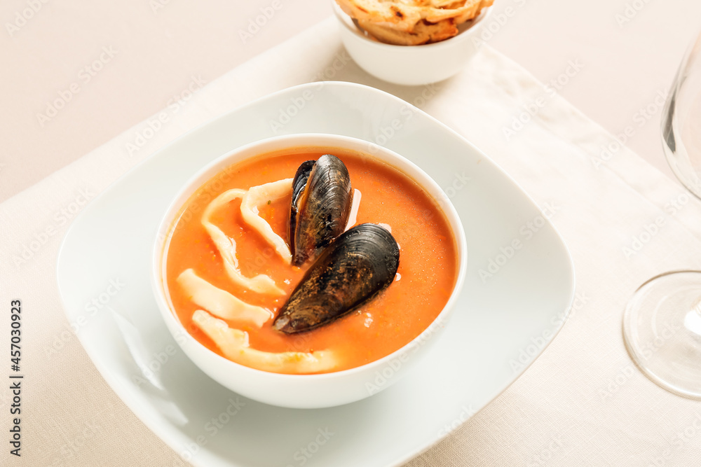 Bowl with tasty Cacciucco soup on table Bowl with tasty Cacciucco soup on table