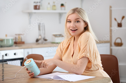 Woman with modern humidifie...