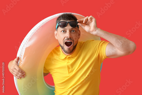 Surprised young man with in...