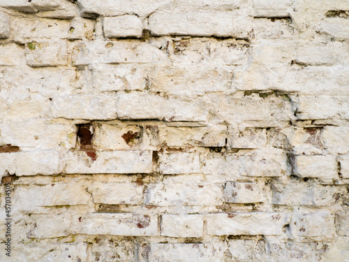 White brick wall. Old crumbling wall